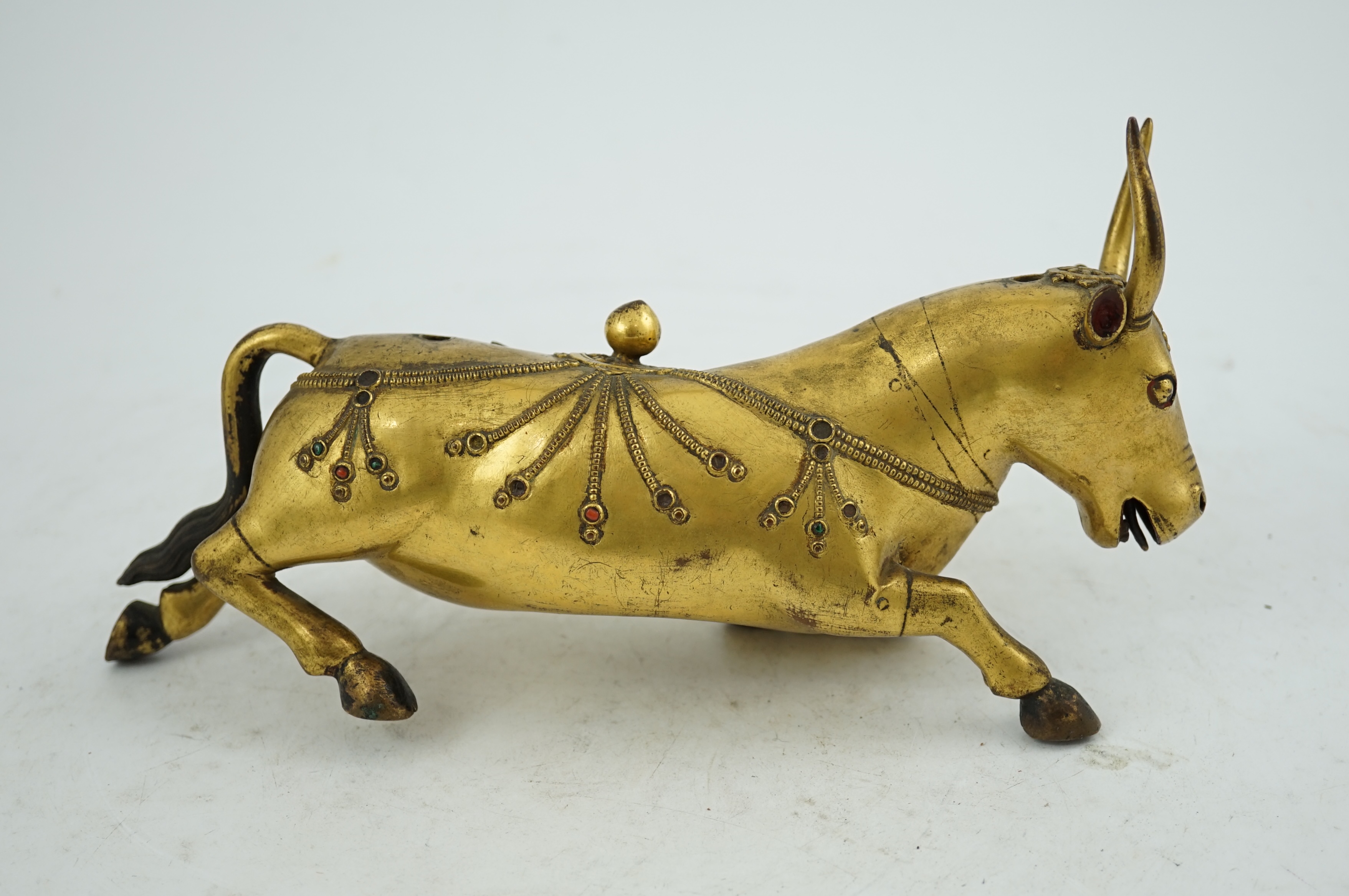 A Tibetan gilt bronze figure of a buffalo, 18th century